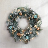 Delightful 60cm LED Christmas Wreath with Snowy Garland and Ornaments - Low Angle