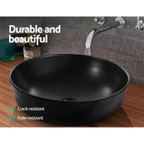 Sleek Matte Black Oval Ceramic Vanity Sink for Above-Counter Installation - 45-Degree Angle