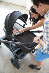 Joovy Comfort Bassinet with Canopy and Carrier Feature - Side View